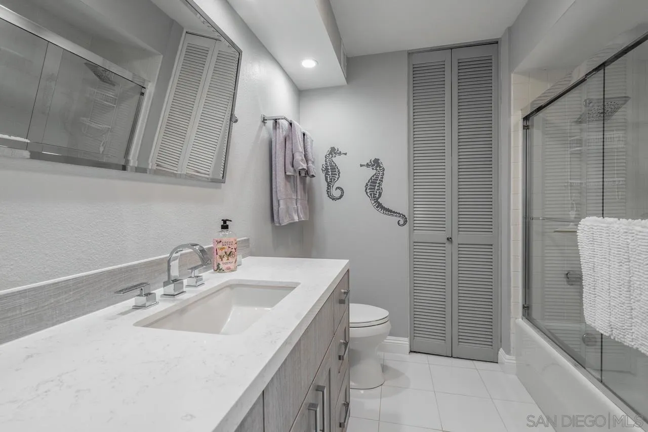 1770 Avenida Del Mundo, Unit 701 Coronado, CA 92118 - Photo 12 of 17 a bathroom with a sink a toilet and shower