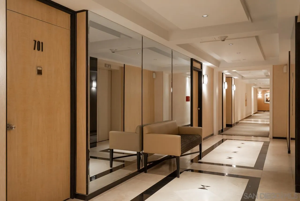 1770 Avenida Del Mundo, Unit 701 Coronado, CA 92118 - Photo 15 of 17 a view of a hallway with furniture and a mirror