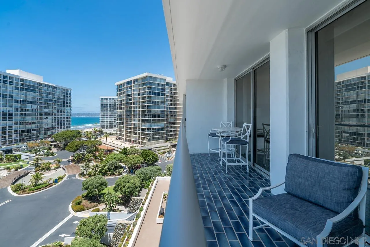1770 Avenida Del Mundo, Unit 701 Coronado, CA 92118 - Photo 8 of 17 a balcony with table and chairs