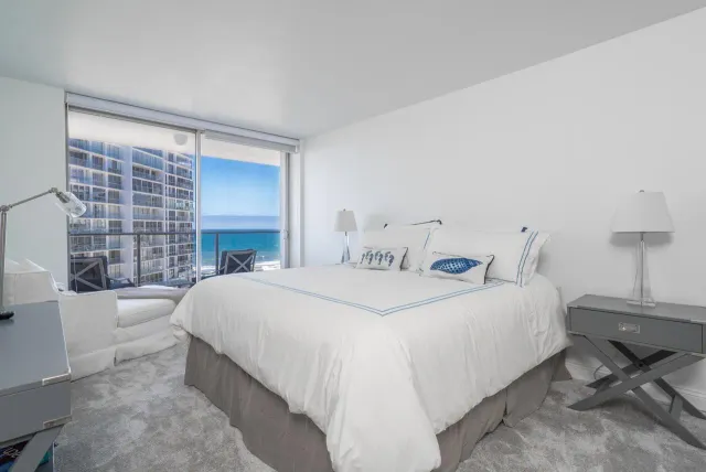 a bedroom with a bed and a fireplace