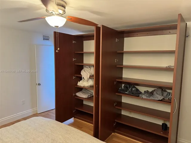 a bedroom with a bed and a closet