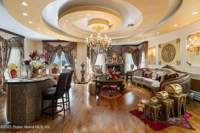 a view of a dining room with furniture and chandelier