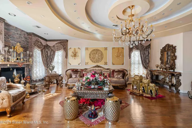 a living room with lots of furniture and kitchen view