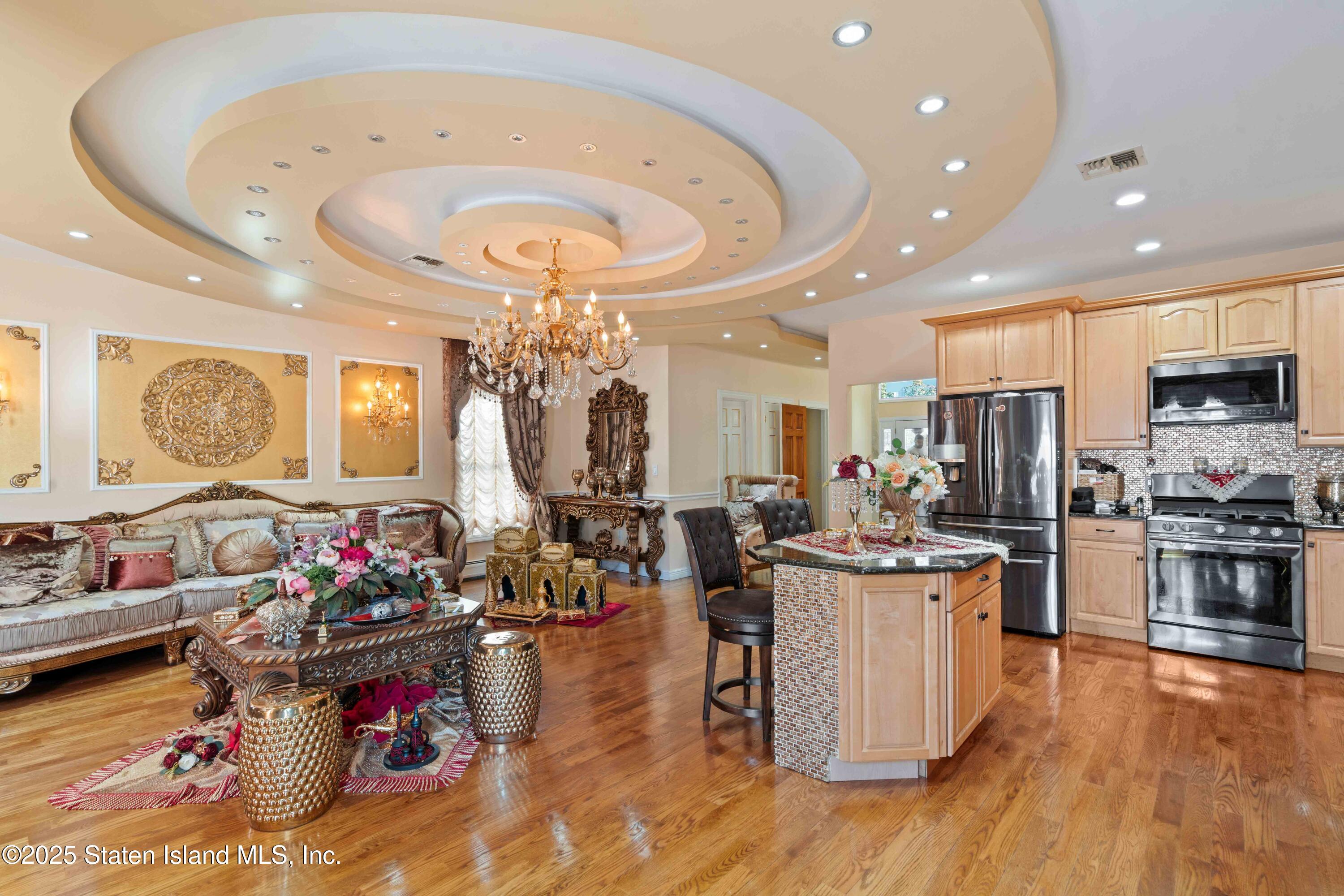 287 Rensselaer Avenue Staten Island, NY 10312 - Photo 13 of 35 a living room with lots of furniture and kitchen view