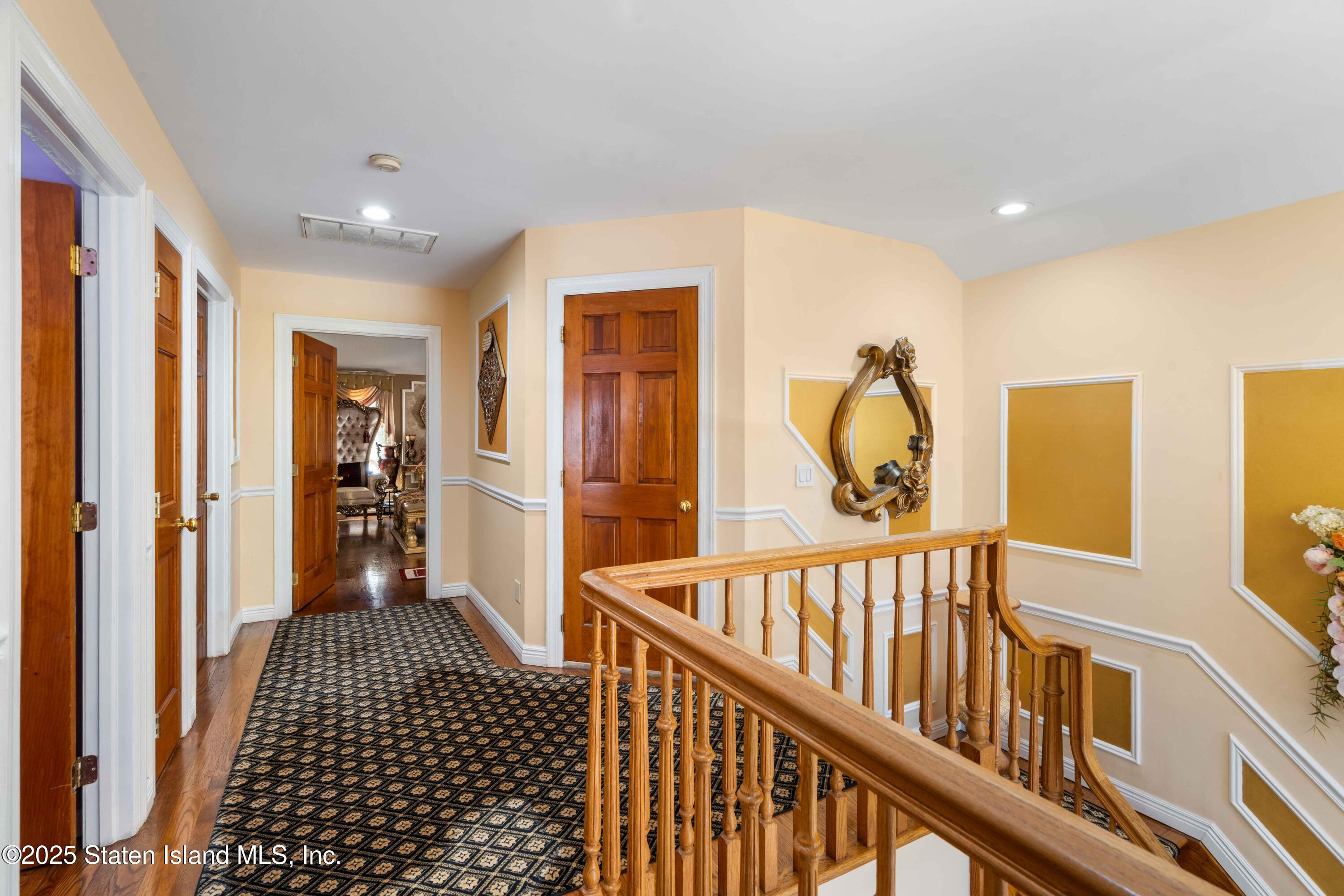 287 Rensselaer Avenue Staten Island, NY 10312 - Photo 19 of 35 a view of a hallway with wooden floor and windows