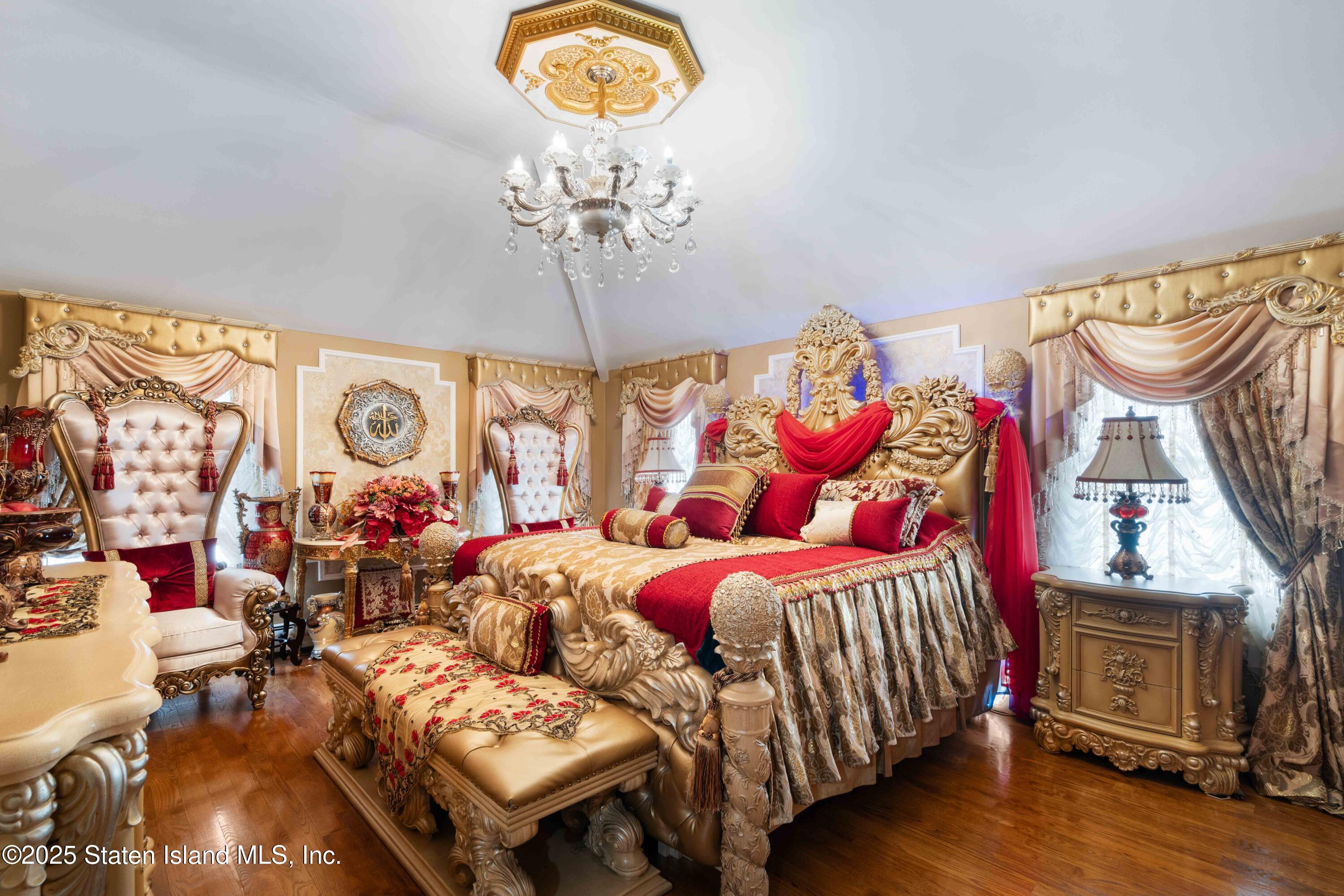287 Rensselaer Avenue Staten Island, NY 10312 - Photo 20 of 35 a bedroom with a bed and a chandelier