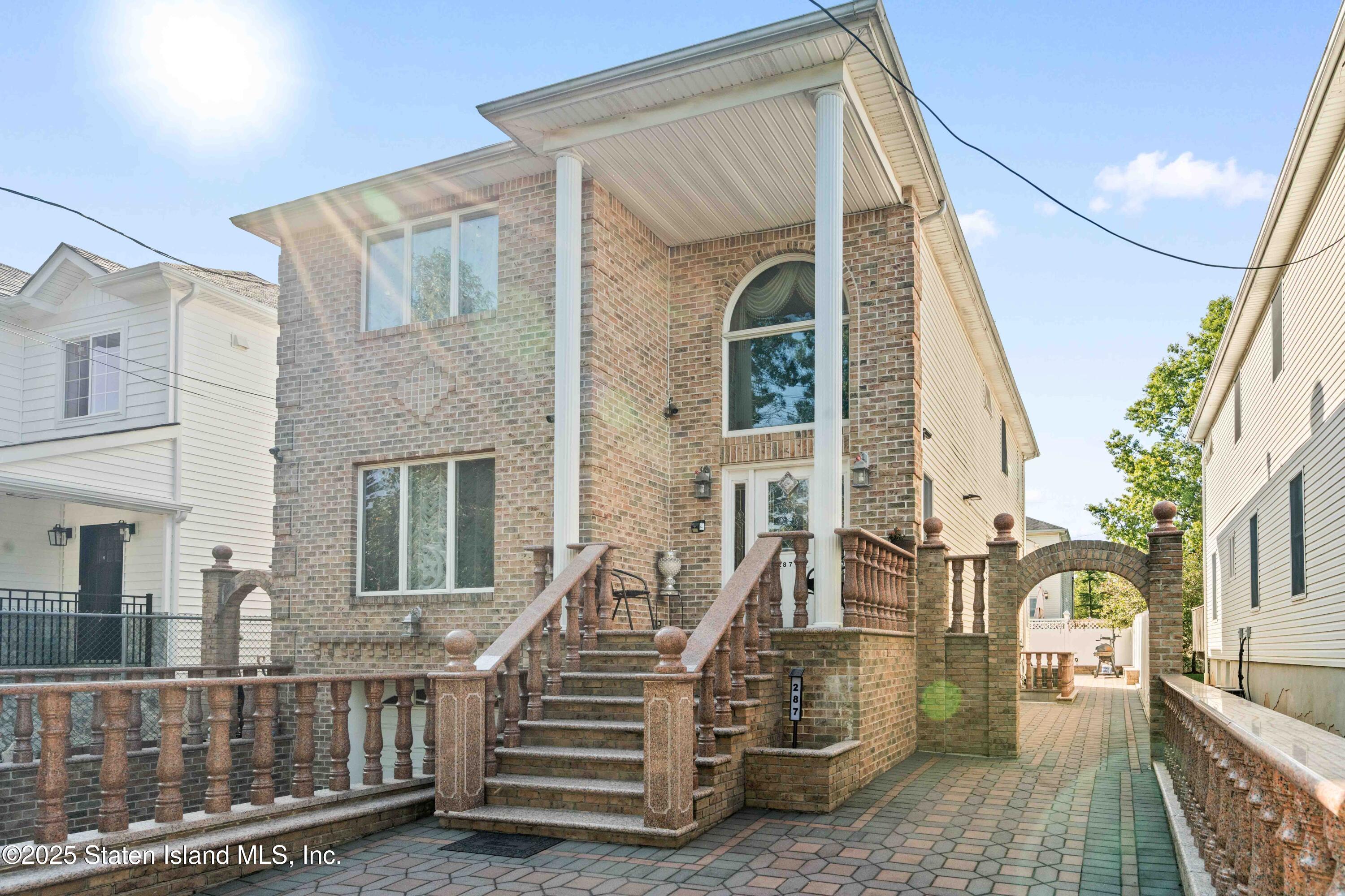 287 Rensselaer Avenue Staten Island, NY 10312 - Photo 2 of 35 a view of a house with wooden floor and fence