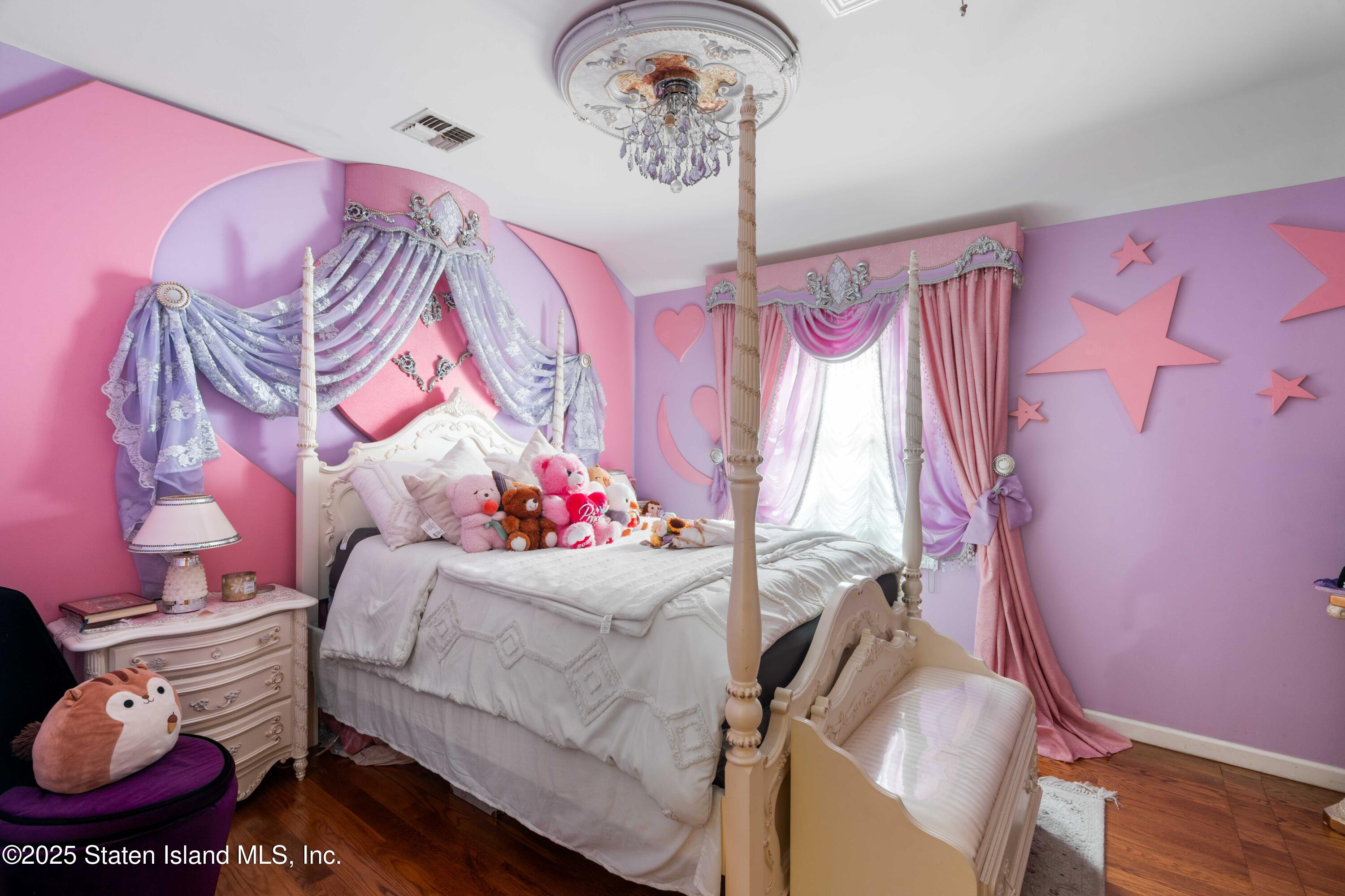 287 Rensselaer Avenue Staten Island, NY 10312 - Photo 26 of 35 a bedroom with a bed and a window