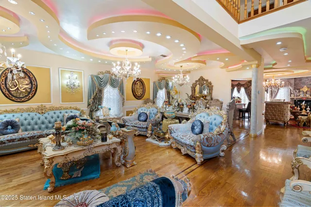 a living room with furniture and a clock