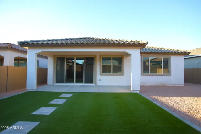 a view of front of house with a yard