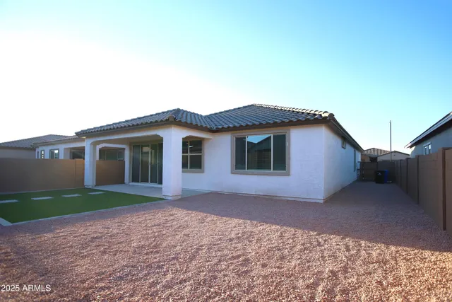 a view of a garden with lawn chairs