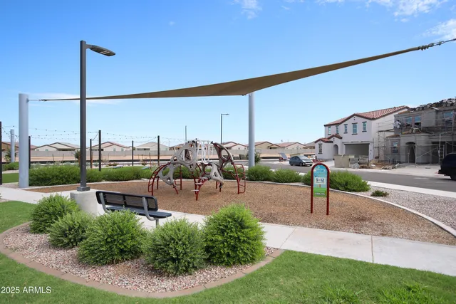 a view of a garden with a house