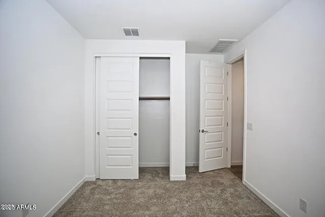 an empty room with closet