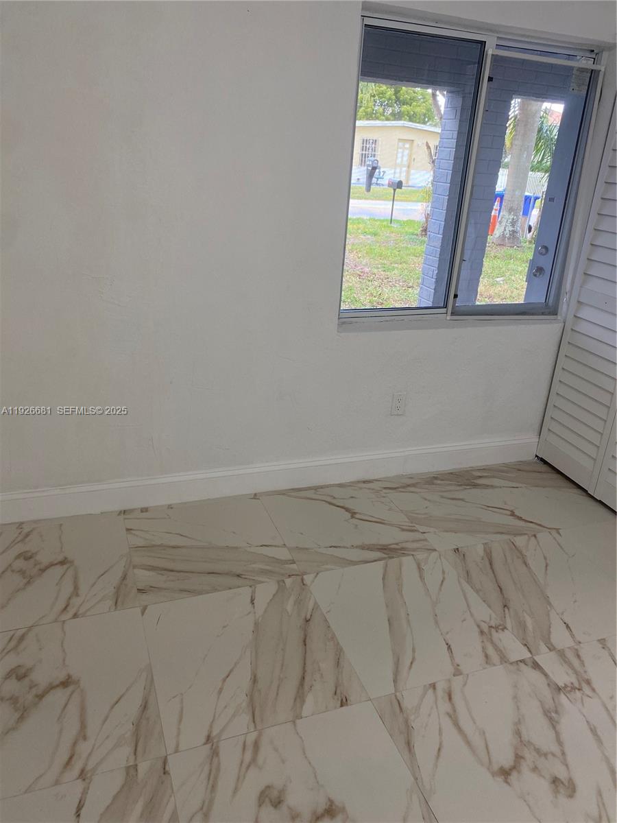 2122 Northwest 5th Street Pompano Beach, FL 33069 - Photo 15 of 53 a view of empty room with window
