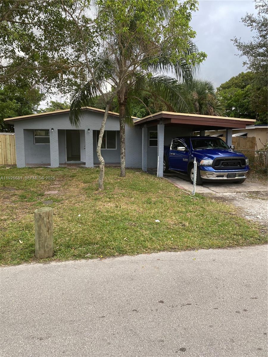 2122 Northwest 5th Street Pompano Beach, FL 33069 - Photo 2 of 53 a view of a house with a yard