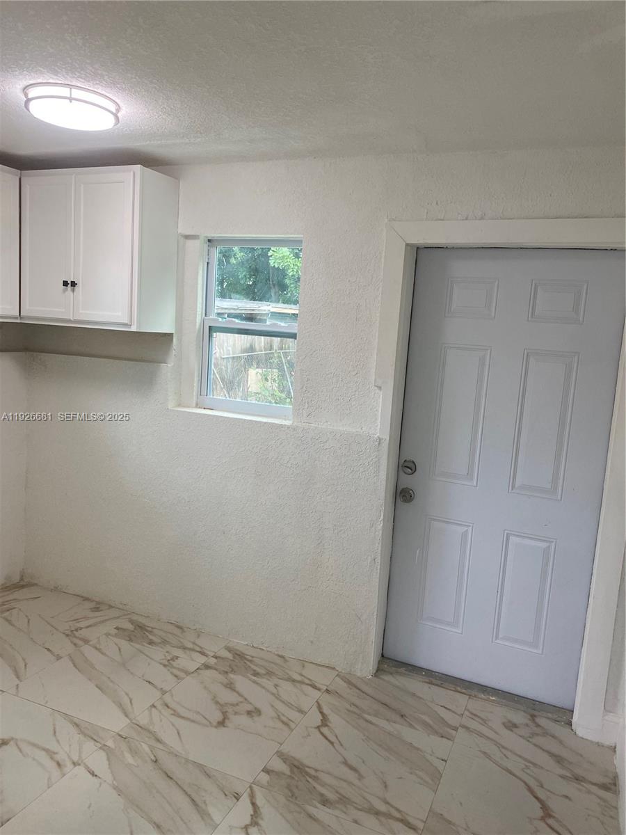 2122 Northwest 5th Street Pompano Beach, FL 33069 - Photo 31 of 53 an empty room with windows