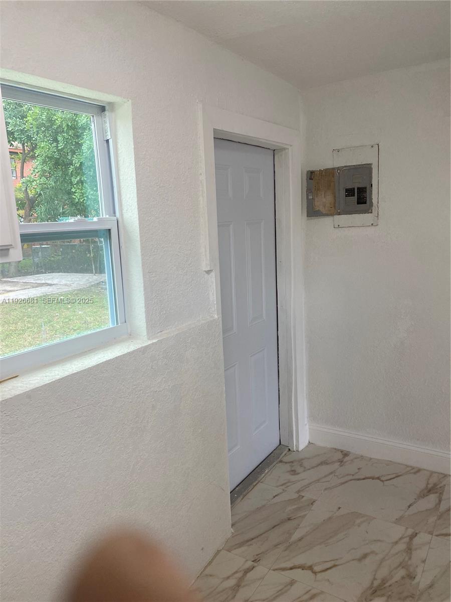 2122 Northwest 5th Street Pompano Beach, FL 33069 - Photo 4 of 53 an empty room with a window