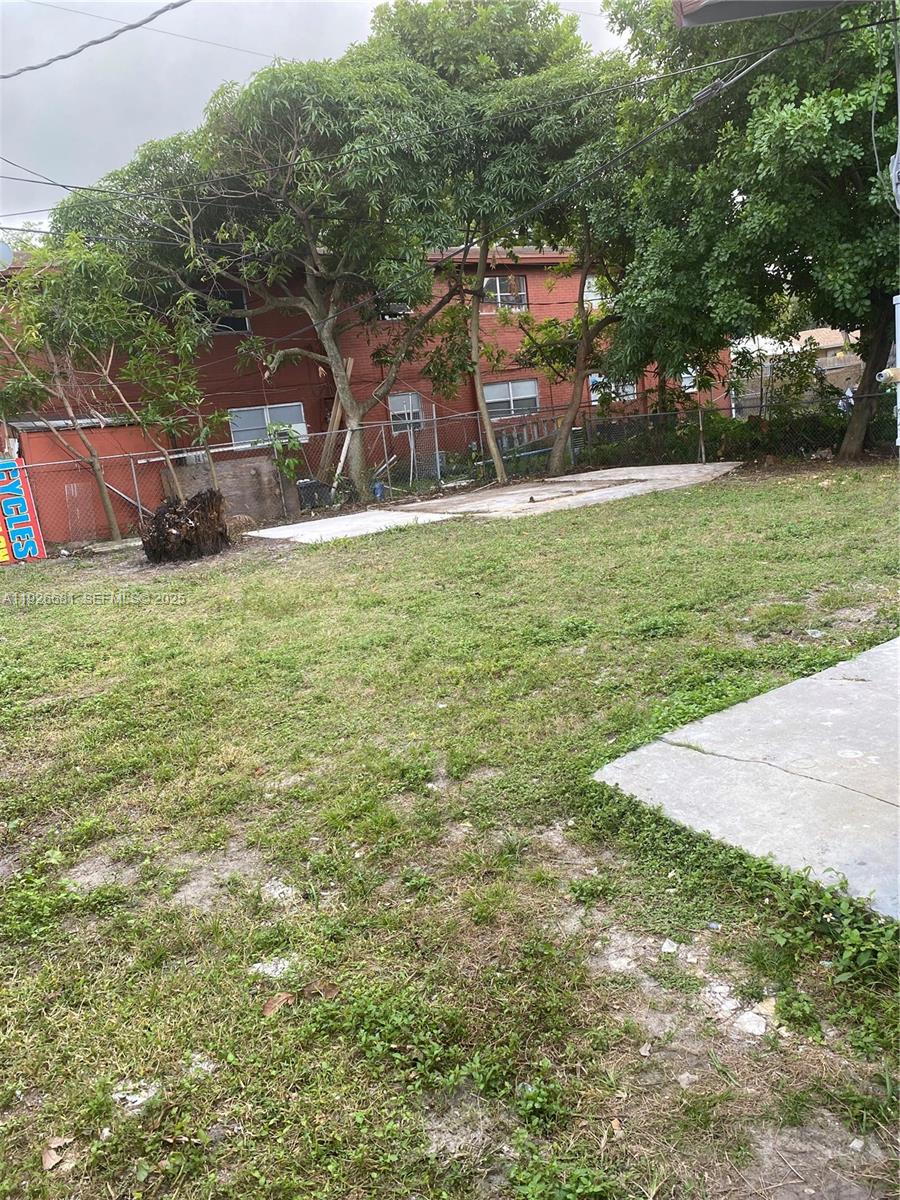 2122 Northwest 5th Street Pompano Beach, FL 33069 - Photo 49 of 53 a backyard of a house with table and chairs