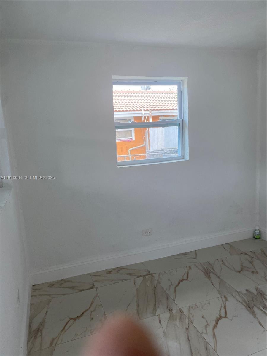 2122 Northwest 5th Street Pompano Beach, FL 33069 - Photo 9 of 53 a view of a room that has a window