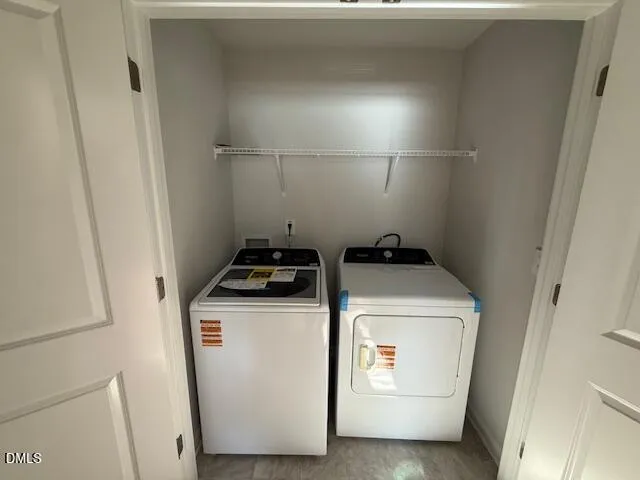 a view of hallway with bathroom