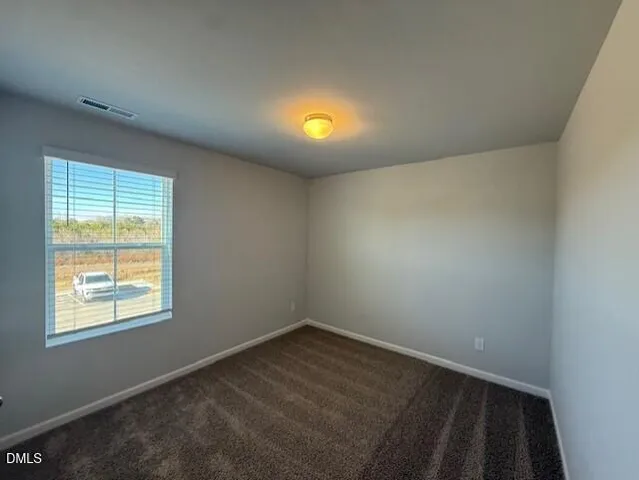 a white toilet sitting next to a bath tub