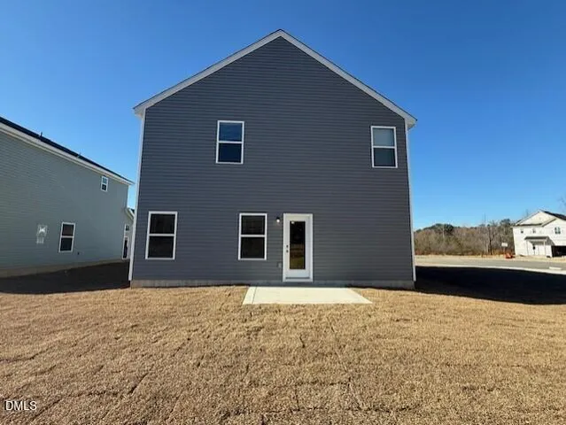 a view of a house with a street