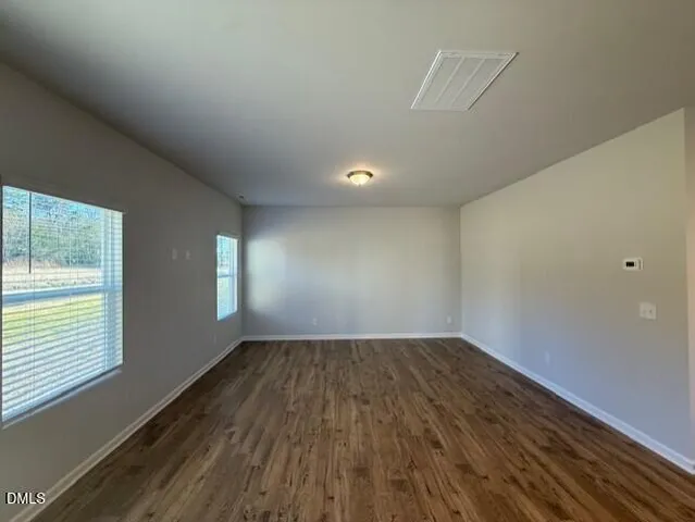 a kitchen with granite countertop a sink a stove and a granite counter top