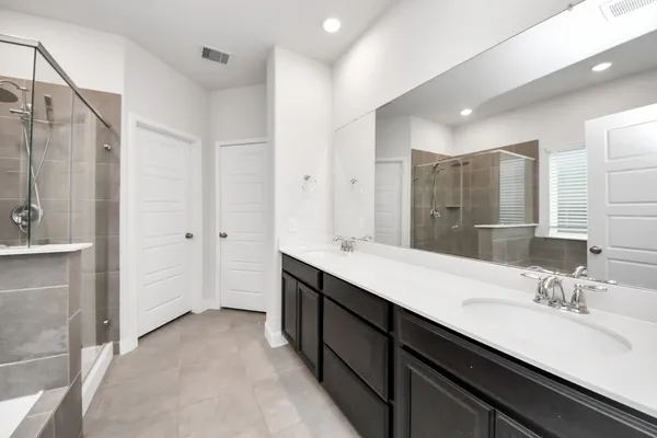 an empty room with a window and a ceiling fan