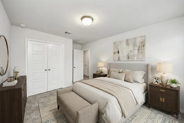 a bathroom with a granite countertop sink a toilet a mirror and shower