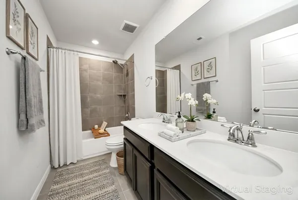 a view of a room with a ceiling fan and a window