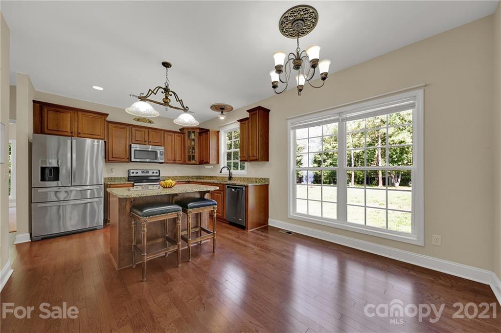 1185 Reservation Road Rock Hill, SC 29730 - Photo 20 of 47 a view of a kitchen with furniture and wooden floor