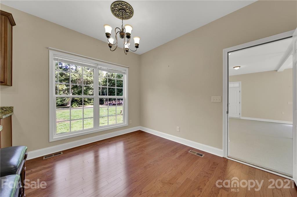1185 Reservation Road Rock Hill, SC 29730 - Photo 21 of 47 a view of an empty room with wooden floor and a window