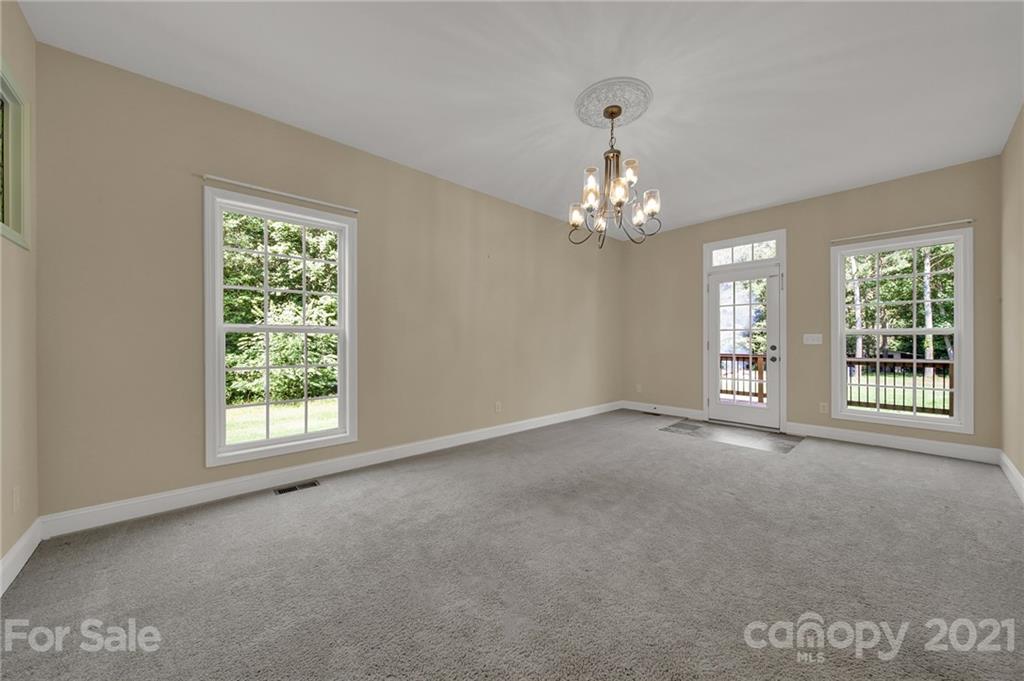 1185 Reservation Road Rock Hill, SC 29730 - Photo 24 of 47 a view of a big room with windows and chandelier