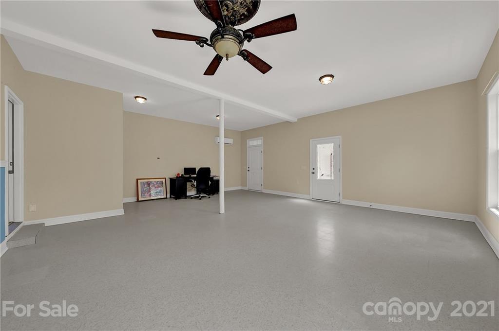 1185 Reservation Road Rock Hill, SC 29730 - Photo 28 of 47 an empty room with chandelier fan and windows
