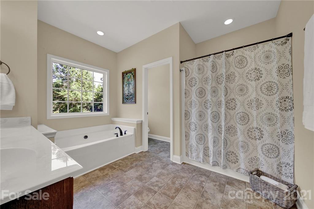 1185 Reservation Road Rock Hill, SC 29730 - Photo 33 of 47 a spacious bathroom with a bathtub and a shower
