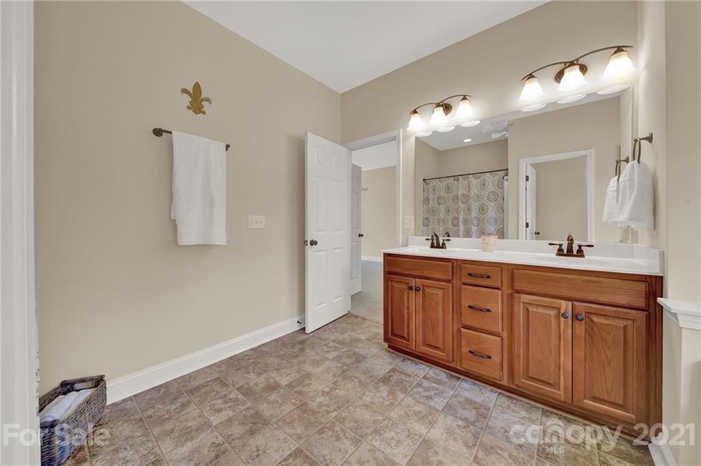 1185 Reservation Road Rock Hill, SC 29730 - Photo 34 of 47 a bathroom with a granite countertop sink and a mirror