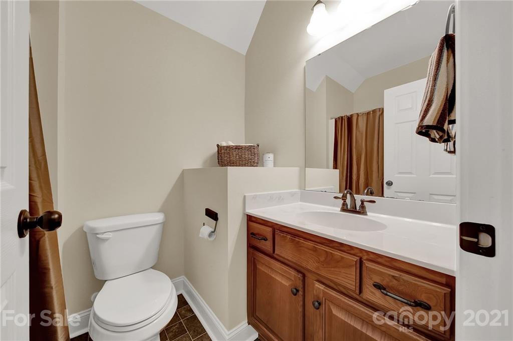 1185 Reservation Road Rock Hill, SC 29730 - Photo 36 of 47 a bathroom with a granite countertop toilet sink and mirror