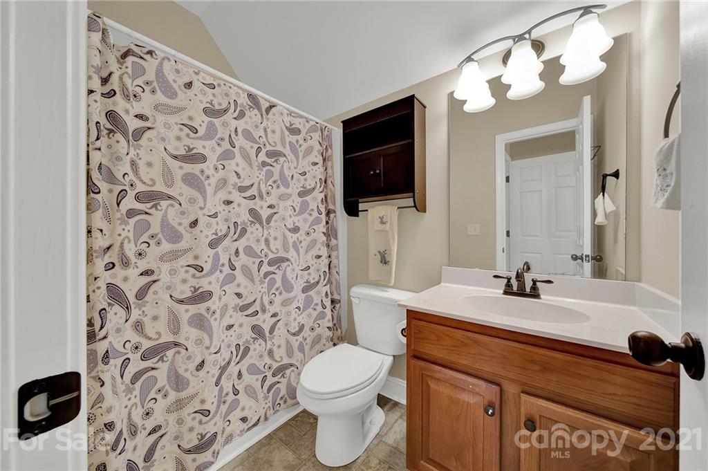 1185 Reservation Road Rock Hill, SC 29730 - Photo 38 of 47 a bathroom with a sink toilet a mirror and shower curtain