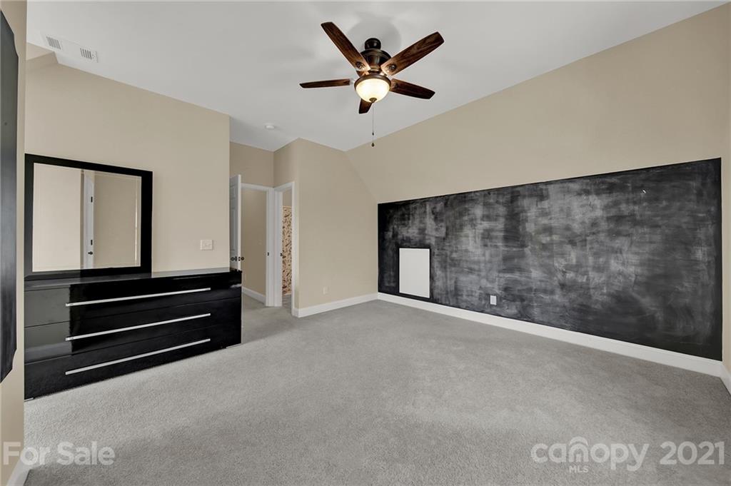 1185 Reservation Road Rock Hill, SC 29730 - Photo 39 of 47 a view of an empty room with cabinet and a ceiling fan