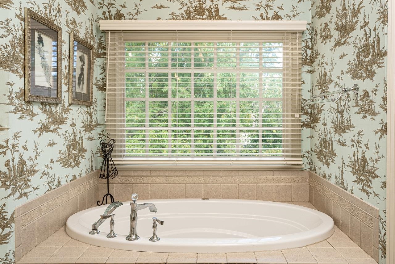 2379 Massanetta Springs Road Harrisonburg, VA 22801 - Photo 33 of 73 a bathroom with bathtub and window