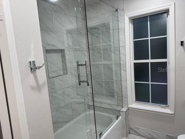 10104 Southwest 17th Place Gainesville, FL 32607 - Photo 12 of 21 a bathroom with a shower