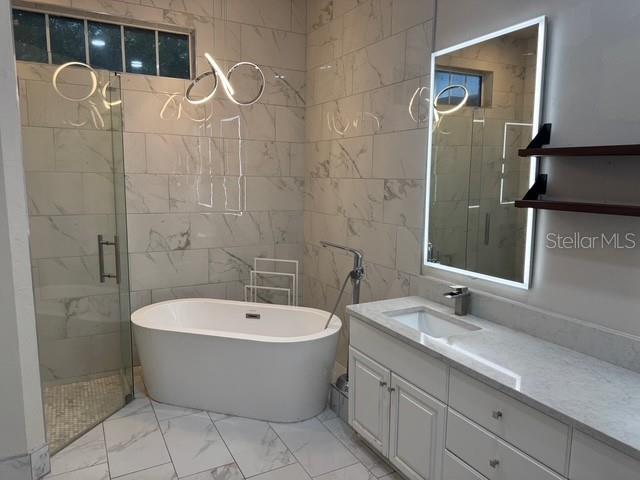 10104 Southwest 17th Place Gainesville, FL 32607 - Photo 14 of 21 a bathroom with a bathtub and shower