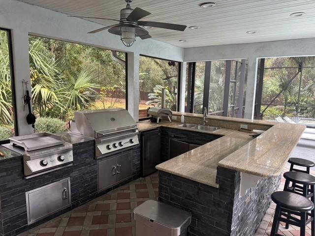 10104 Southwest 17th Place Gainesville, FL 32607 - Photo 19 of 21 a kitchen with a stove and a sink