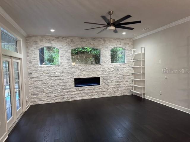 10104 Southwest 17th Place Gainesville, FL 32607 - Photo 6 of 21 a view of a livingroom with wooden floor and a ceiling fan