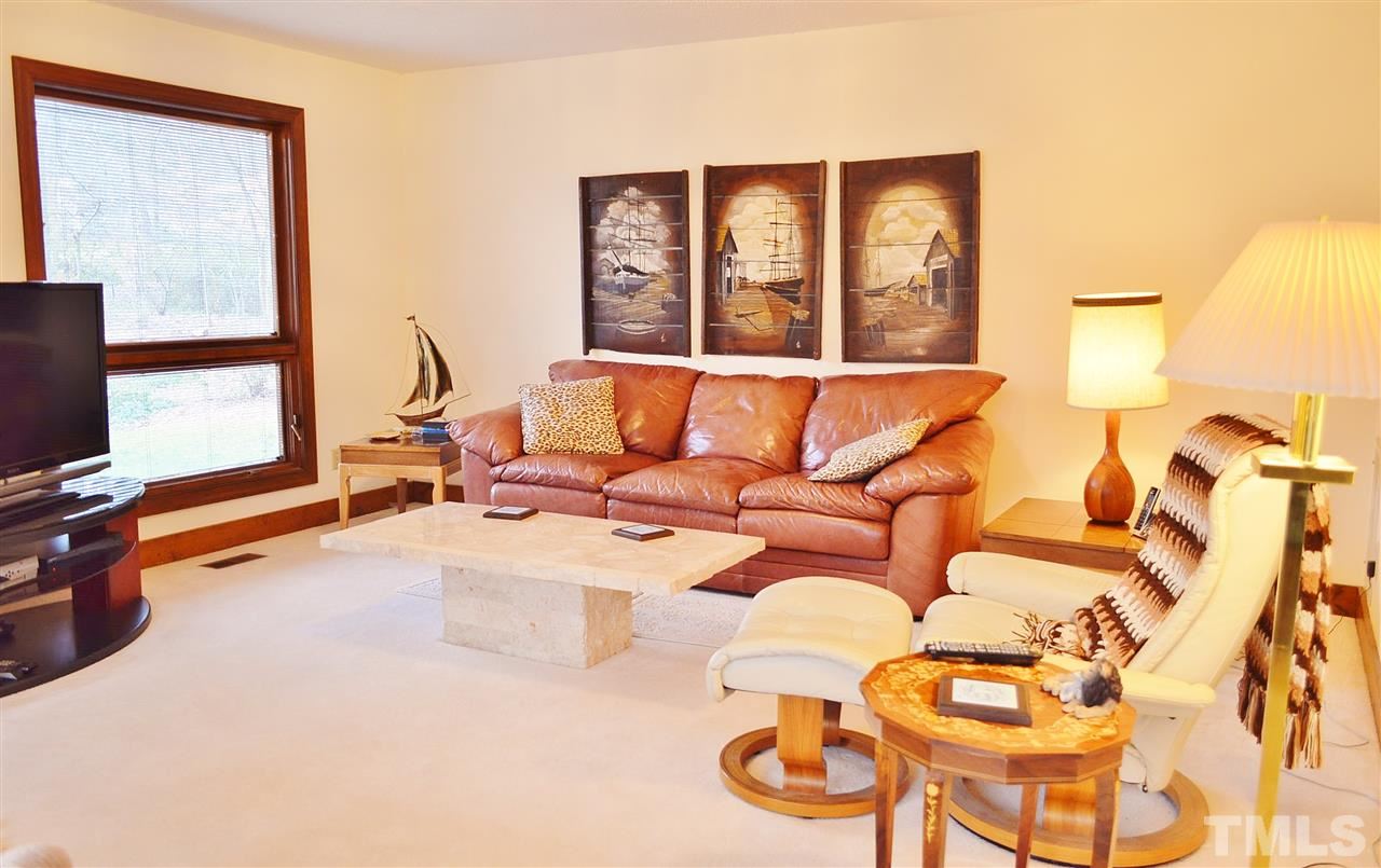 5200 Caber Road Raleigh, NC 27613 - Photo 12 of 25 a living room with furniture and a flat screen tv
