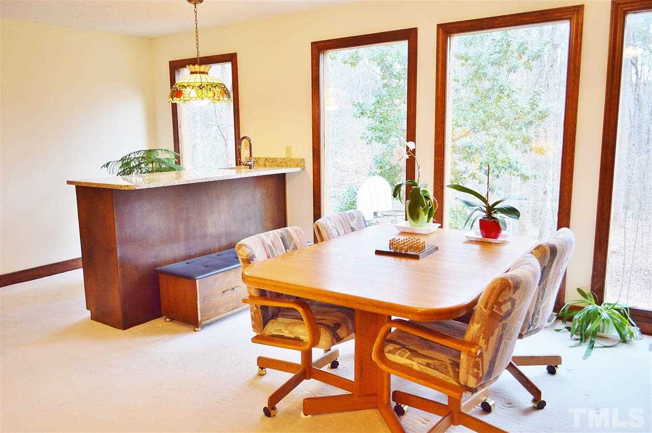5200 Caber Road Raleigh, NC 27613 - Photo 14 of 25 a view of a dining room with furniture and a window