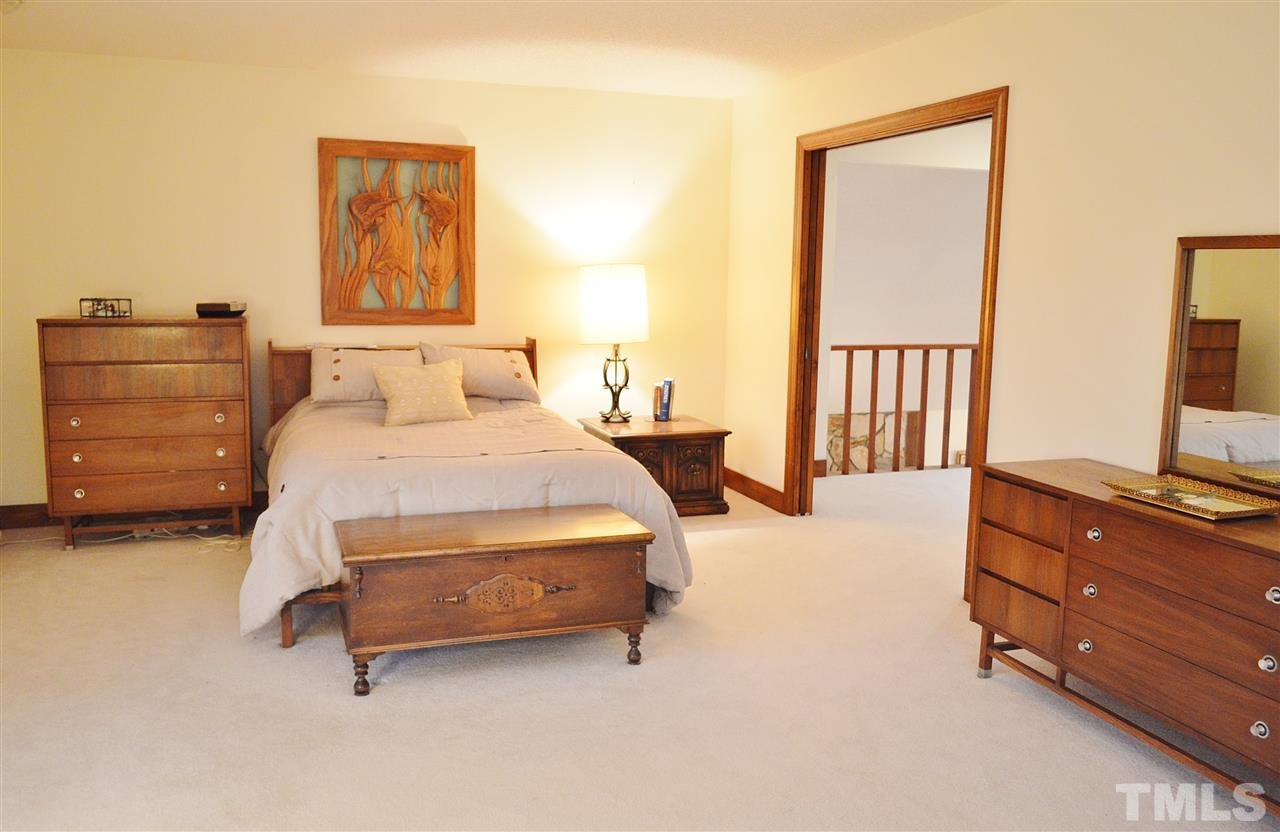 5200 Caber Road Raleigh, NC 27613 - Photo 16 of 25 a bedroom with a bed and furniture