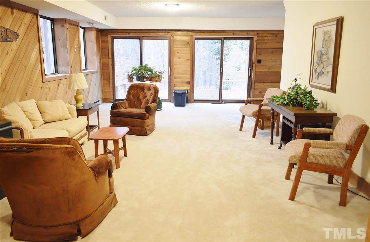 5200 Caber Road Raleigh, NC 27613 - Photo 23 of 25 a living room with furniture and a large window