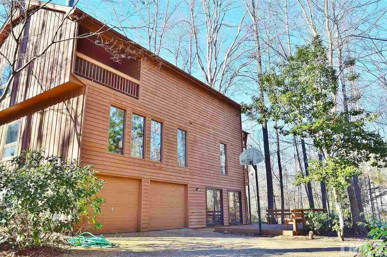 5200 Caber Road Raleigh, NC 27613 - Photo 24 of 25 a front view of a building with a garden