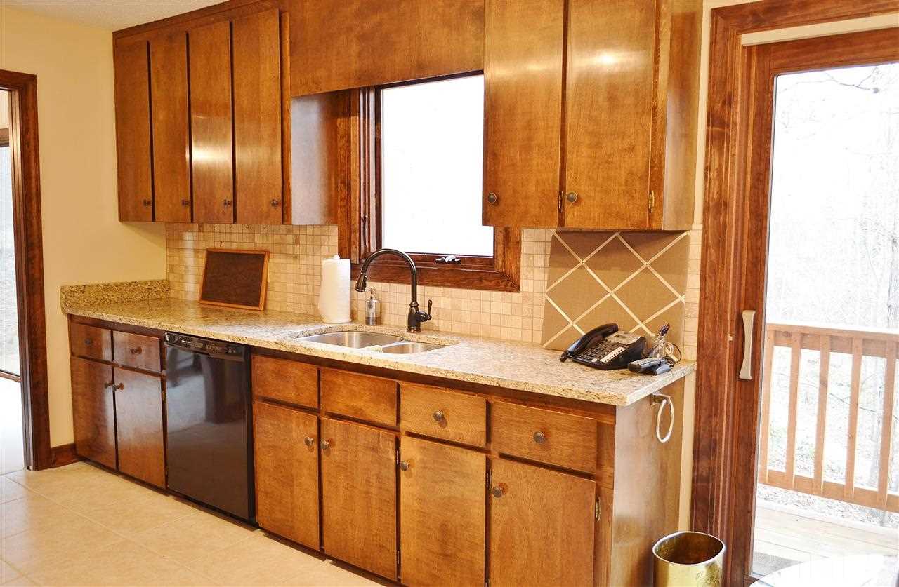5200 Caber Road Raleigh, NC 27613 - Photo 10 of 25 a bathroom with a sink and a mirror